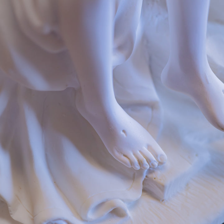White Pieta Statue on a Black Base