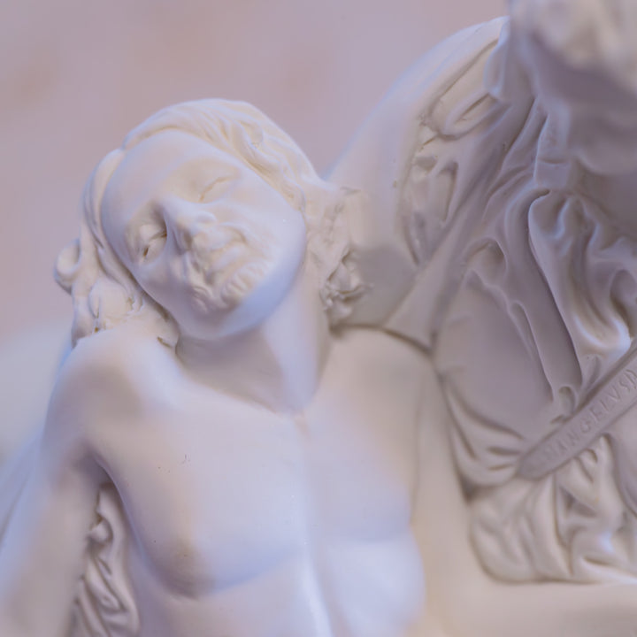 White Pieta Statue on a Black Base