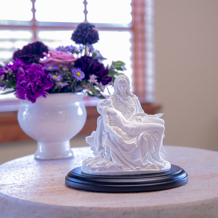White Pieta Statue on a Black Base