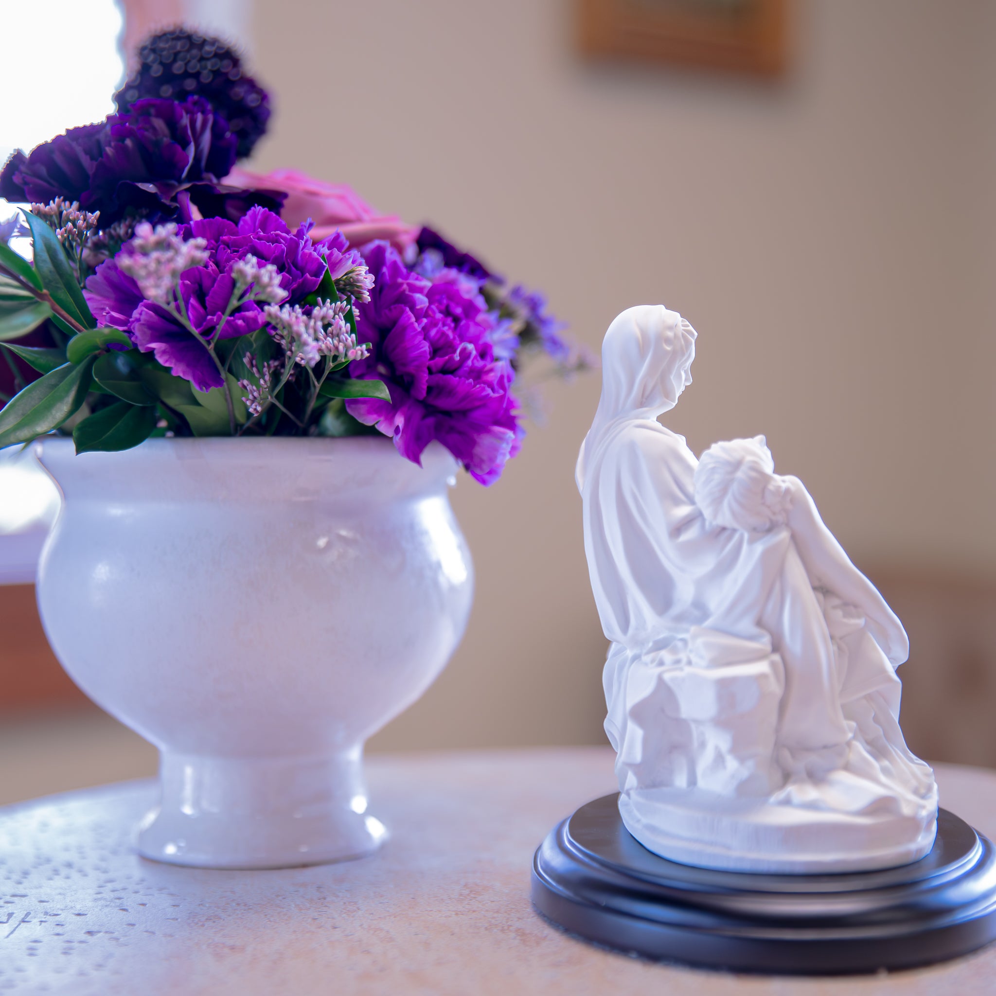 White Pieta Statue on a Black Base